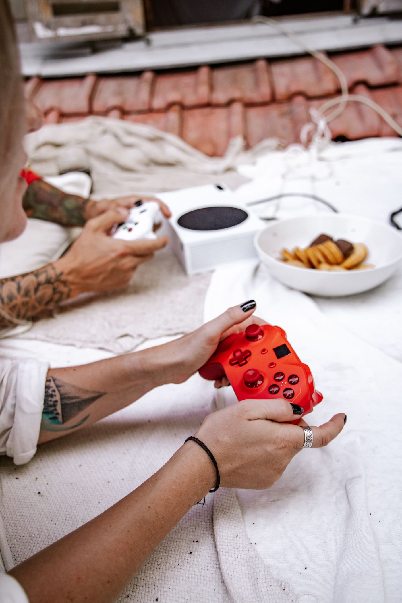 Two players holding game controllers